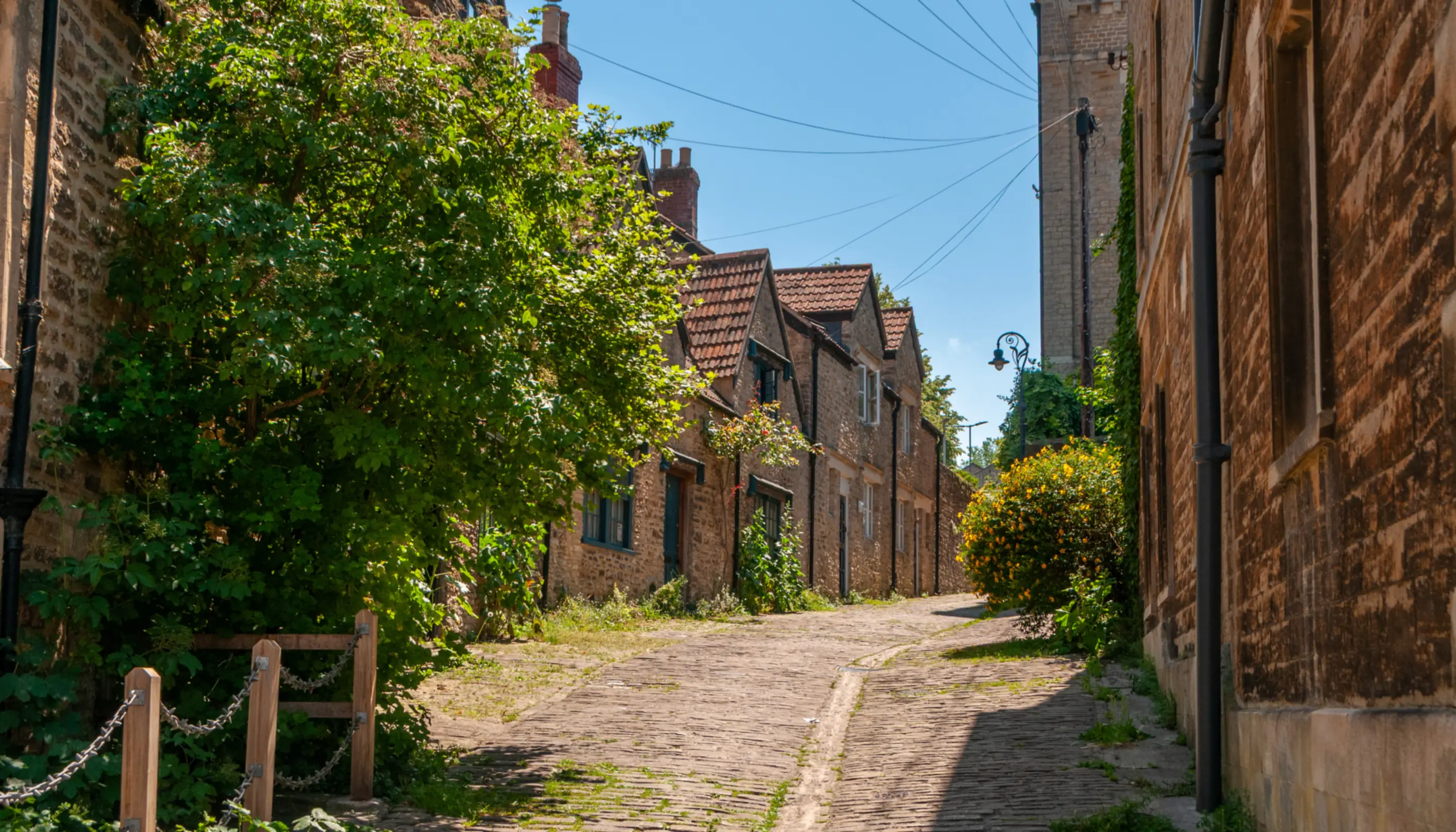 Gentle Street in Frome, a cobbled lane lined with traditional Somerset stone cottages